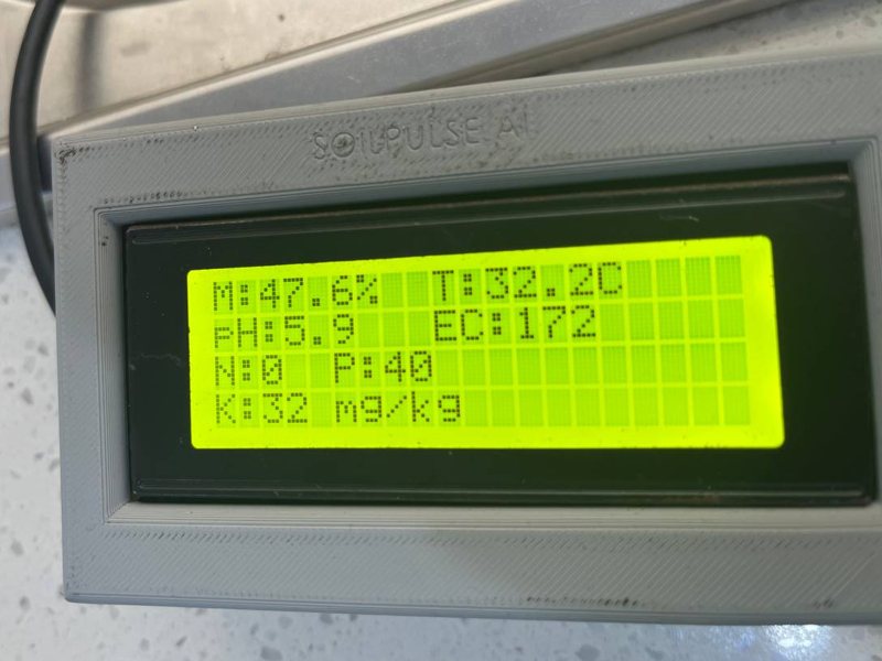 Close-up of the SoilPulse reader screen showing moisture 47.6 percent, temperature 32.2 degrees, pH 5.9, EC 172, nitrogen 0, phosphorus 40 and potassium 32 milligrams per kilogram
